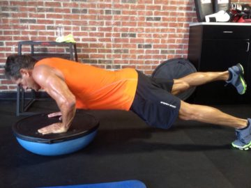 Client Robert Knotek shredded arms legs pushups on Bosu ball after picture